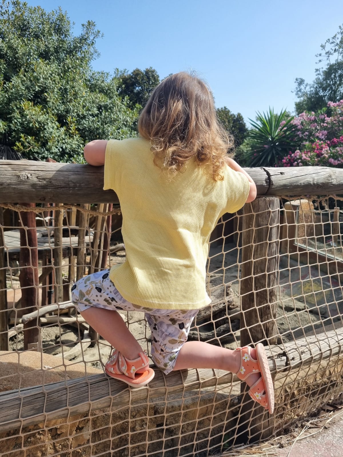 handmade organic top and shorts being worn by a child playing outside