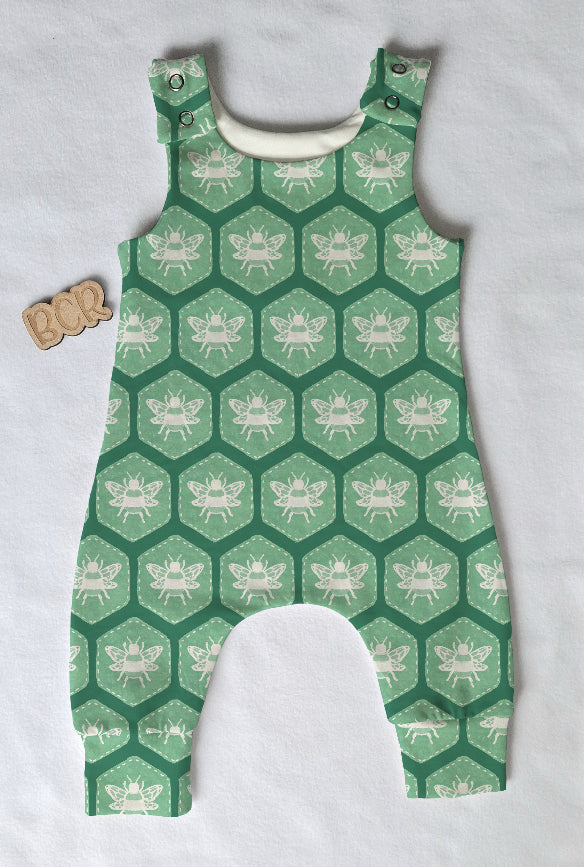 grow with me organic cotton baby romper, featuring bees in green hexagons