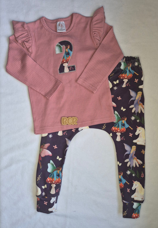 personalised embroidered second birthday t-shirt, with organic cotton appliqué featuring unicorns and fairies